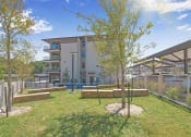 Thumbnail 32 of 35 - the preserve at ballantyne commons courtyard with trees and a building