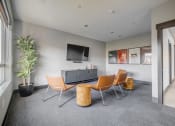 Thumbnail 10 of 25 - media room with a tv and a table and chairs