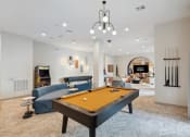 Thumbnail 21 of 30 - a game room with a pool table and a tv