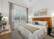 Thumbnail 3 of 30 - a bedroom with a large bed and two windows