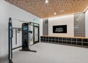 Thumbnail 30 of 30 - the gym at the top of the building is equipped with weights and a treadmill