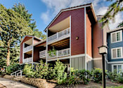 Thumbnail 46 of 48 - Apartment building with covered balconies and red siding at Canyon Creek Apartments, Oregon, 97070