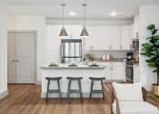 Thumbnail 18 of 29 - a kitchen with white cabinets and a large island with three stools