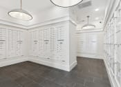 Thumbnail 29 of 29 - a locker room with white lockers and two lights