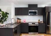 Thumbnail 12 of 23 - apartment kitchen
