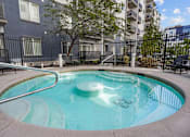 Thumbnail 25 of 30 - A small pool with a metal fence around it.