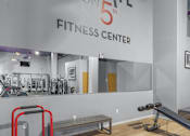 Thumbnail 19 of 30 - A gym with a sign that says Elevate on 5th Fitness Center.