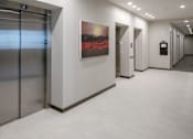 Thumbnail 20 of 30 - A hallway with an elevator