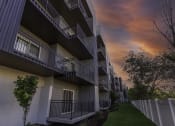 Thumbnail 24 of 25 - a row of apartments with balconies at sunset