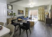Thumbnail 3 of 25 - a furnished living room and dining room with a table and chairs