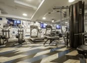 Thumbnail 22 of 25 - a gym with exercise machines and a wall covered motivational words wall-paper