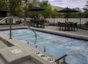 Thumbnail 20 of 25 - outdoor hot tub and a patio with tables