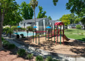 Thumbnail 9 of 13 - Apartments In Livermore, CA For Rent - Autumn Springs - Children's Playground Adjacent To Pool And Grass Area