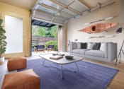 Thumbnail 30 of 30 - Staged Living room with open garage door at Allez, Redmond