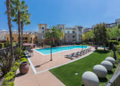 Thumbnail 10 of 30 - shot overlooking pool deck, lounge chairs, and grass area