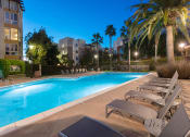 Thumbnail 13 of 30 - pool and lounge chairs evening time