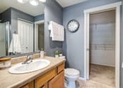 Thumbnail 10 of 37 - a bathroom with a toilet sink mirror and shower