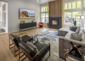 Thumbnail 18 of 38 - a living room with a couch and chairs and a fireplace at Arbor Heights, Tigard, Oregon