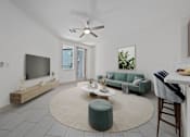 Thumbnail 4 of 31 - A living room with a grey sofa, a white coffee table, and a ceiling fan.