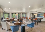 Thumbnail 21 of 30 - the reserve at bucklin hill clubhouse with tables and chairs at Allez, Redmond, WA 98052