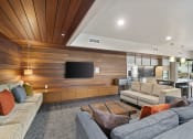 Thumbnail 17 of 30 - a living room with wood paneling and a tv on the wall at Allez, Redmond, 98052