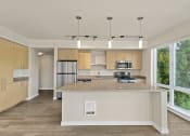 Thumbnail 11 of 30 - a kitchen with a large island with granite countertops at Allez, Washington, 98052