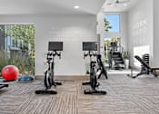 Thumbnail 16 of 34 - A gym with a motivational quote on the wall.