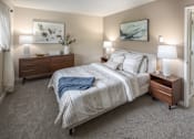 Thumbnail 11 of 29 - Bedroom with a bed and two nightstands and a closet at Summerfield, Tigard, OR, 97224