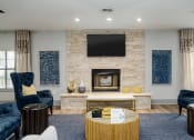 Thumbnail 18 of 23 - a living room with a fireplace and a television