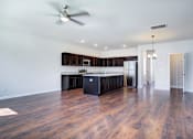 Thumbnail 21 of 30 - Empty living room and kitchen