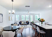 Thumbnail 1 of 30 - Dining area with round table and four chairs