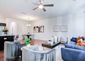 Thumbnail 3 of 30 - Spacious living room with dining area and modern decor