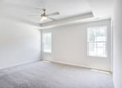 Thumbnail 28 of 30 - Empty spare bedroom with ceiling fan