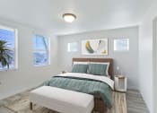 Thumbnail 46 of 51 - a bedroom with white walls and a bed with a green comforter