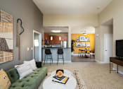 Thumbnail 22 of 24 - the view from the living room into the kitchen and dining room of an apartment