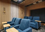 Thumbnail 10 of 24 - a room filled with blue chairs and tables
