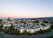 Thumbnail 14 of 24 - an aerial view of the city at sunset