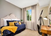 Thumbnail 8 of 22 - furnished model bedroom blue and yellow sheets