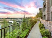 Thumbnail 2 of 22 - sunset and blue skyline along apartment exteriors