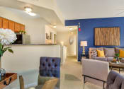 Thumbnail 9 of 22 - model unit - view of kitchen, dining room, and living room