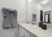 Thumbnail 52 of 53 - a bathroom with a sink and a mirror at Enclave, Paramount