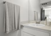 Thumbnail 51 of 53 - a bathroom with a sink and a mirror at Enclave, Paramount California