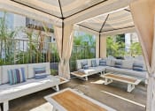 Thumbnail 22 of 53 - a patio with couches and tables at Enclave, Paramount, 90723