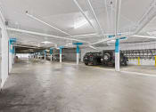 Thumbnail 26 of 53 - a parking garage with cars parked in it at Enclave, Paramount California at Enclave, Paramount 