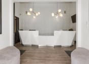 Thumbnail 33 of 53 - a white reception desk sitting on top of a hard wood floor at Enclave, Paramount, CA 