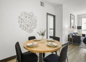 Thumbnail 39 of 53 - a dining room with a table and chairs at Enclave, Paramount California