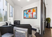 Thumbnail 38 of 53 - a room with a desk and two chairs and a painting on the wall at Enclave, Paramount 