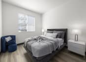 Thumbnail 44 of 53 - a bedroom with a large bed next to a window at Enclave, Paramount, 90723