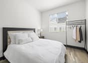 Thumbnail 42 of 53 - a bedroom with a large bed and a closet at Enclave, California
