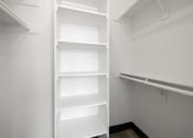 Thumbnail 48 of 53 - a walk in closet with a white shelving unit at Enclave, Paramount, 90723